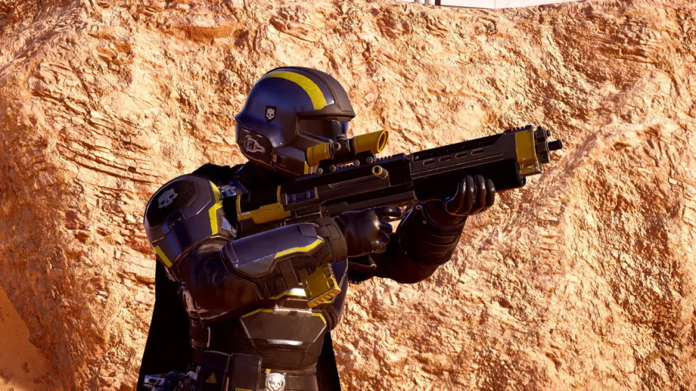 Helldiver mira um rifle Liberator em cenário rochoso de Helldivers 2